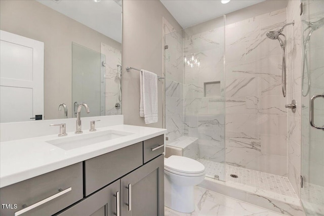 bathroom with a marble finish shower, marble look tile flooring, toilet, and vanity