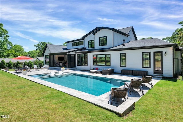 rear view of house featuring an outdoor living space with a fire pit, a patio, and an outdoor pool