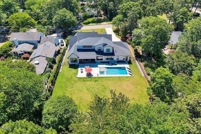 aerial view of residential area featuring a pool area