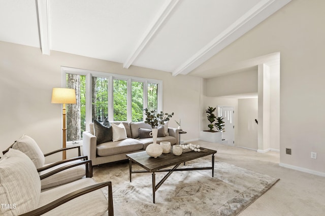 living room featuring beam ceiling, light carpet, baseboards, and high vaulted ceiling
