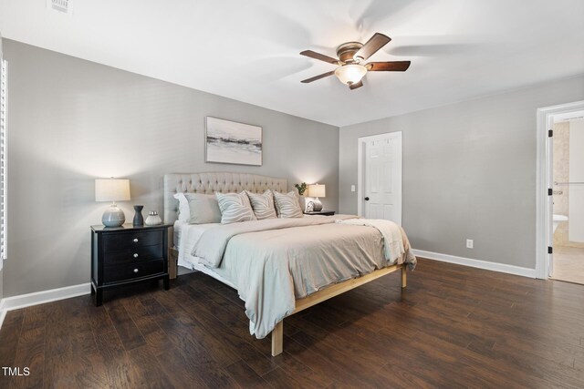 bedroom featuring wood finished floors, baseboards, ceiling fan, and connected bathroom