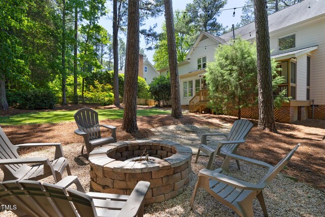 view of patio / terrace featuring a fire pit and a deck