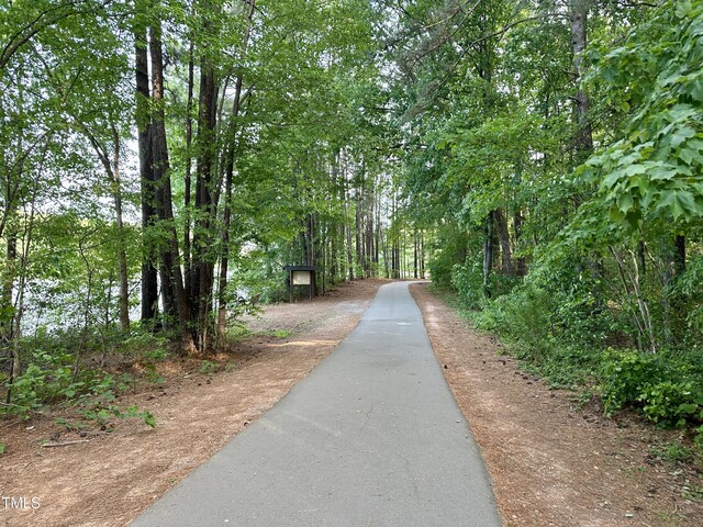 surrounding community featuring a view of trees