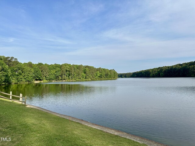 water view featuring a heavily wooded area