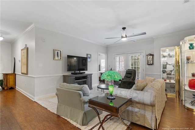 living area featuring ceiling fan, crown molding, french doors, and wood finished floors