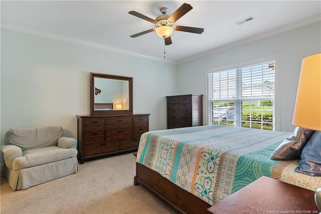 bedroom with ceiling fan, ornamental molding, visible vents, and light colored carpet