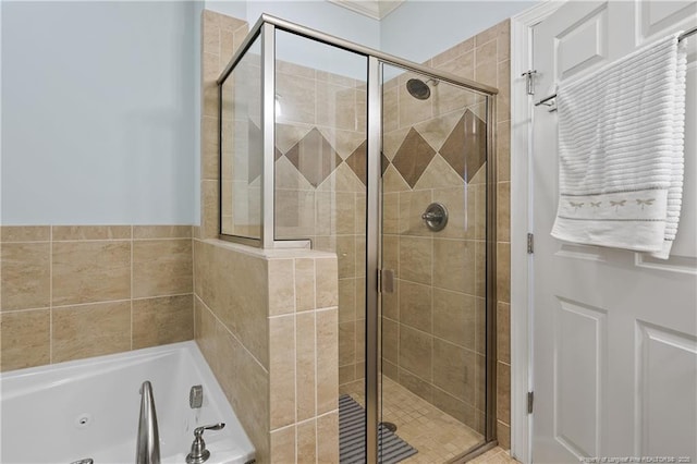 full bath with a jetted tub and a shower stall