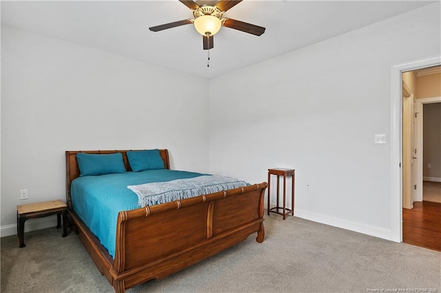 bedroom featuring carpet flooring, baseboards, and a ceiling fan