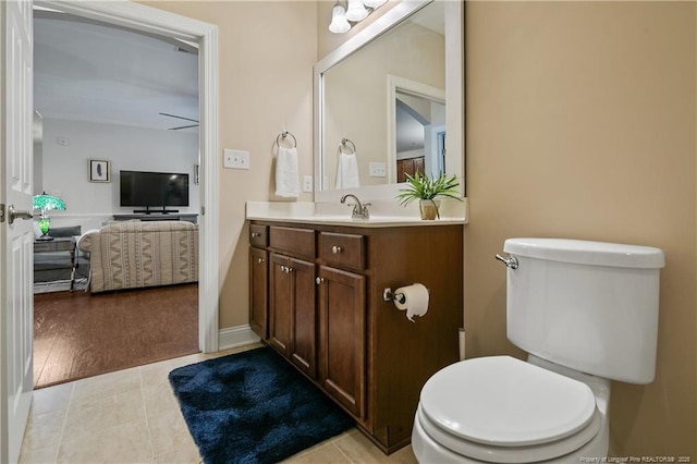 bathroom featuring tile patterned floors, toilet, and vanity