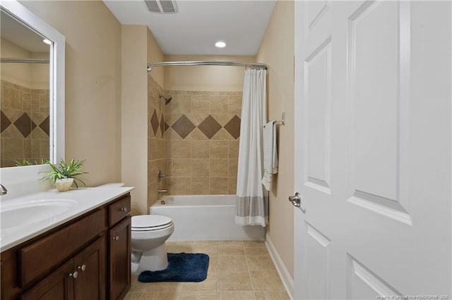 bathroom featuring toilet, shower / bath combo with shower curtain, visible vents, tile patterned flooring, and vanity