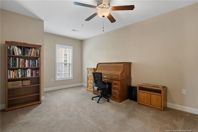 home office featuring carpet, baseboards, a ceiling fan, and visible vents