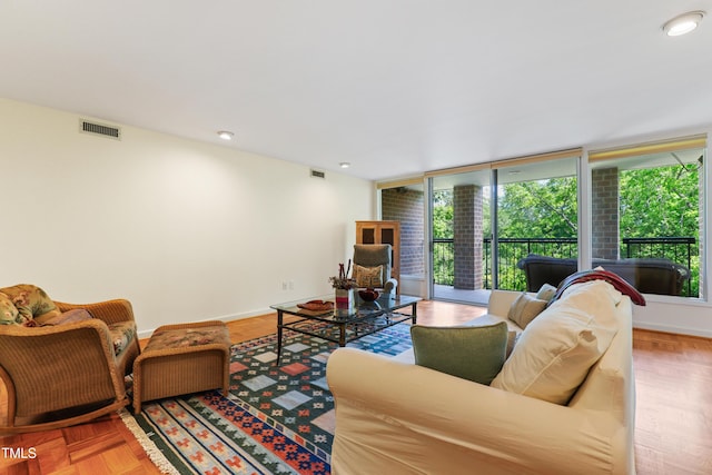 living room with plenty of natural light and baseboards