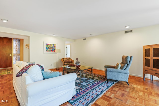living room featuring baseboards and recessed lighting