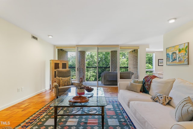 living area with floor to ceiling windows and baseboards