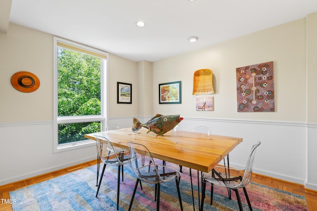 dining room featuring baseboards and recessed lighting