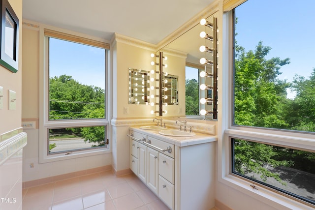 bathroom with tile patterned floors and double vanity