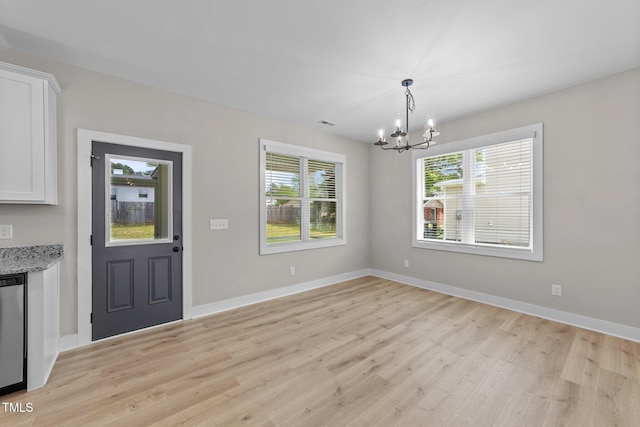 412 W Stallings St, Clayton, NC 27520 - unfurnished dining area with baseboards, a notable chandelier, visible vents, and light wood-type flooring