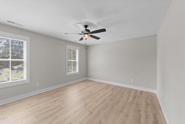412 W Stallings St, Clayton, NC 27520 - unfurnished room featuring baseboards, visible vents, light wood-style flooring, and ceiling fan
