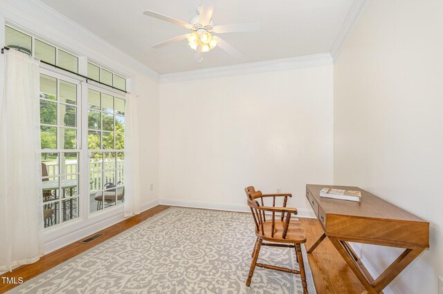 101 Rainbow Dr, Carrboro, NC 27510 - sitting room featuring crown molding, wood finished floors, baseboards, and a ceiling fan