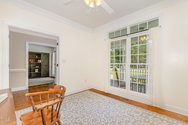 101 Rainbow Dr, Carrboro, NC 27510 - unfurnished room featuring wood finished floors, ornamental molding, ceiling fan, and baseboards