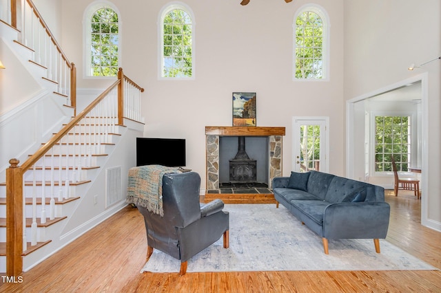 101 Rainbow Dr, Carrboro, NC 27510 - living area featuring healthy amount of natural light, wood finished floors, stairs, and a high ceiling