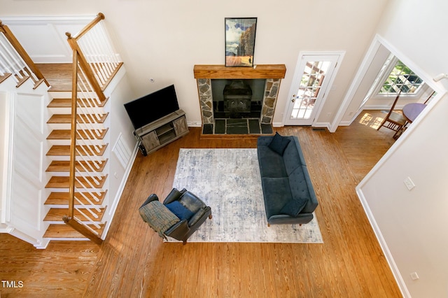 101 Rainbow Dr, Carrboro, NC 27510 - living room with wood finished floors, stairway, and baseboards