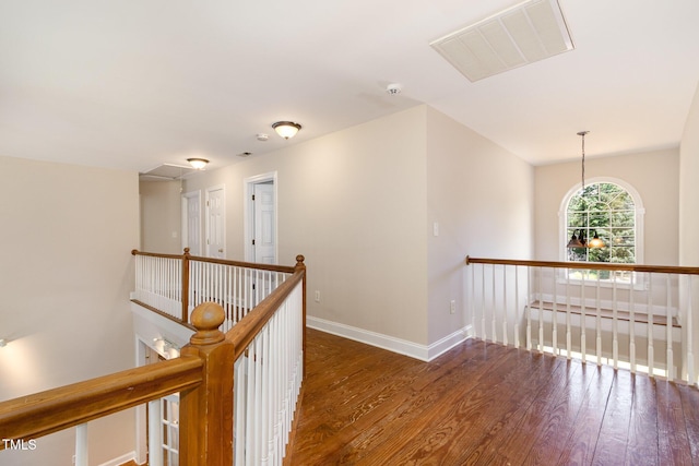 101 Rainbow Dr, Carrboro, NC 27510 - hall featuring an upstairs landing, hardwood / wood-style floors, and baseboards