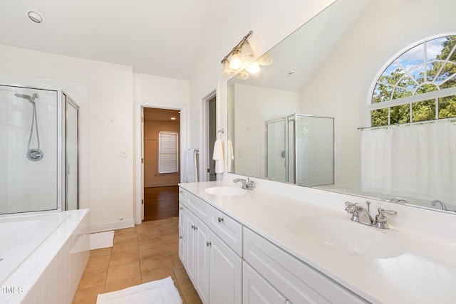 101 Rainbow Dr, Carrboro, NC 27510 - full bathroom with a shower stall, tile patterned floors, double vanity, a bath, and high vaulted ceiling