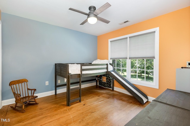 101 Rainbow Dr, Carrboro, NC 27510 - bedroom with baseboards, light wood-style flooring, and a ceiling fan