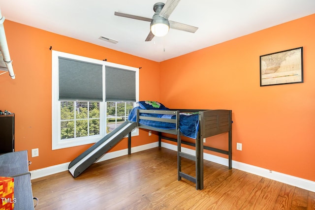 101 Rainbow Dr, Carrboro, NC 27510 - bedroom featuring baseboards, wood finished floors, and ceiling fan