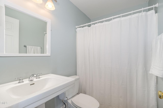 101 Rainbow Dr, Carrboro, NC 27510 - bathroom with a sink, toilet, and a shower with shower curtain