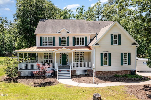 101 Rainbow Dr, Carrboro, NC 27510 - view of front facade with covered porch and a front yard