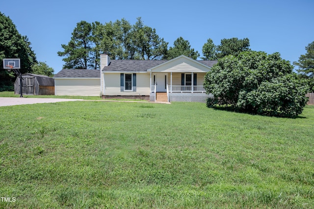 111 Marshay Meadow Rd, Youngsville, NC 27596 - single story home featuring covered porch, a storage shed, a front lawn, a chimney, and crawl space