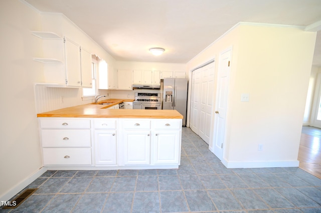 111 Marshay Meadow Rd, Youngsville, NC 27596 - kitchen with stainless steel appliances, open shelves, healthy amount of natural light, white cabinets, and crown molding