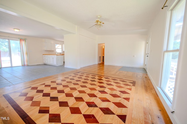 111 Marshay Meadow Rd, Youngsville, NC 27596 - unfurnished living room with a ceiling fan and light wood-style floors