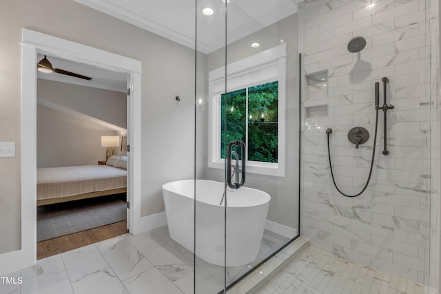 ensuite bathroom with marble finish floors, ornamental molding, a freestanding bath, baseboards, and tiled shower