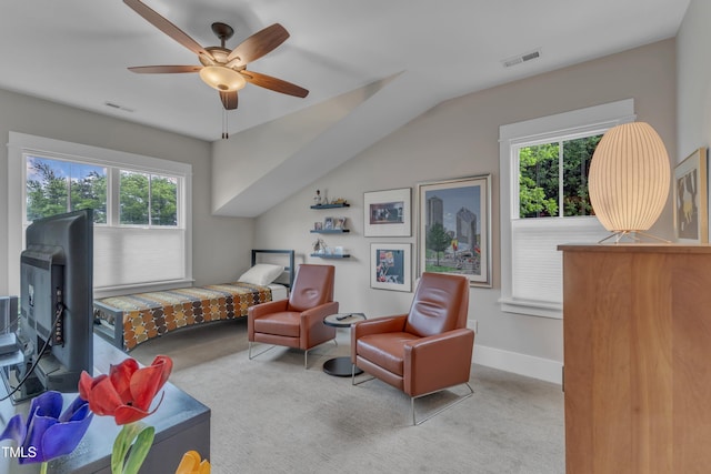 carpeted bedroom featuring multiple windows, a ceiling fan, lofted ceiling, and baseboards