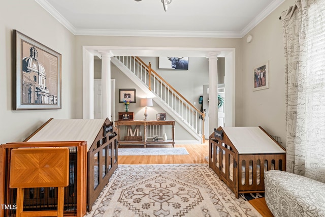 112 Nelson Ln, Clayton, NC 27527 - entryway with ornate columns, wood finished floors, crown molding, and stairs