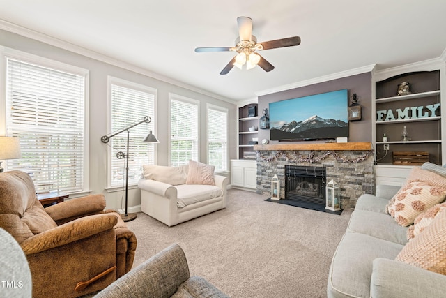 112 Nelson Ln, Clayton, NC 27527 - living room with crown molding, a ceiling fan, a stone fireplace, built in shelves, and carpet