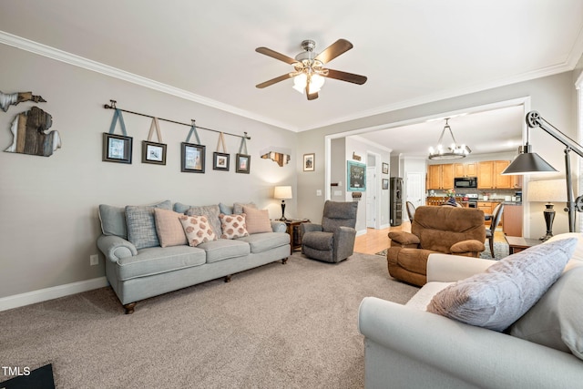 112 Nelson Ln, Clayton, NC 27527 - living room featuring ornamental molding, a chandelier, a ceiling fan, baseboards, and light colored carpet