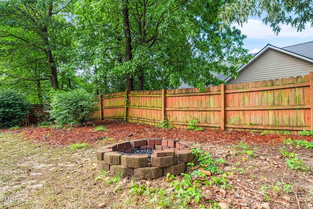 112 Nelson Ln, Clayton, NC 27527 - fenced backyard featuring a fire pit
