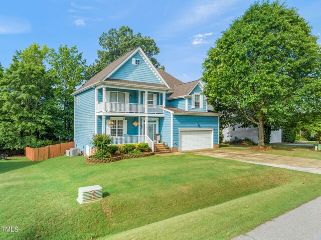 112 Nelson Ln, Clayton, NC 27527 - view of front facade featuring a balcony, covered porch, driveway, and an attached garage
