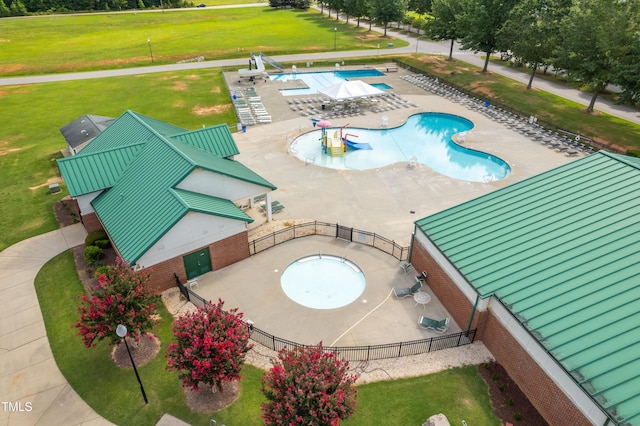 112 Nelson Ln, Clayton, NC 27527 - community pool featuring a patio and a water play area
