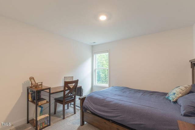 bedroom with light carpet, baseboards, and visible vents