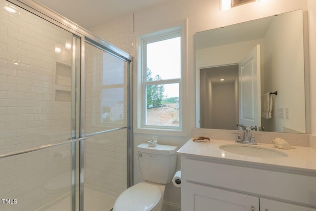 full bath featuring vanity, toilet, and a stall shower