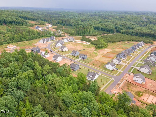 bird's eye view featuring a residential view and a view of trees