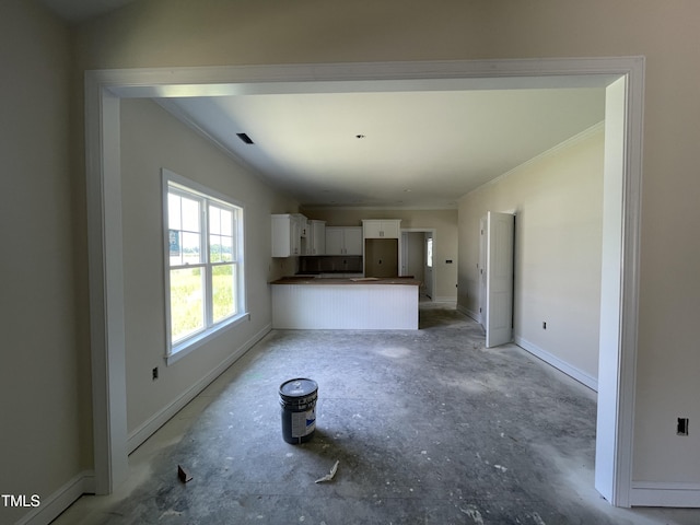 506 S Vance St, Fremont, NC 27830 - unfurnished living room featuring ornamental molding and baseboards