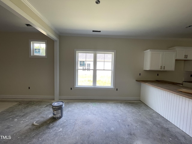 506 S Vance St, Fremont, NC 27830 - unfurnished dining area featuring ornamental molding and baseboards