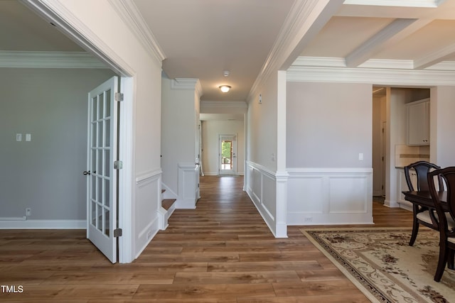3536 Greenville Loop Rd, Wake Forest, NC 27587 - hall with ornamental molding, wood finished floors, and a wainscoted wall