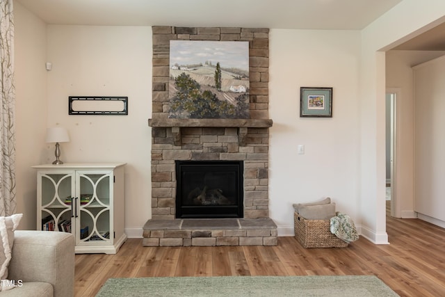 3536 Greenville Loop Rd, Wake Forest, NC 27587 - living room featuring wood finished floors, a fireplace, and baseboards